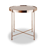 A round copper-colored metal side table with a reflective tabletop stands isolated against a white background.