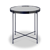 A round table with a reflective surface and dark rim, supported by a crossed metal frame, stands isolated on a light background.