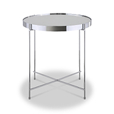 A round, silver-colored metal table stands center, featuring a reflective tabletop and crisscrossed legs, isolated against a white background.
