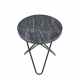 A round table with a marbled top and a black metal base stands isolated against a white background.