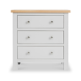 A white three-drawer chest with a natural wood top and round silver knobs on a plain background.