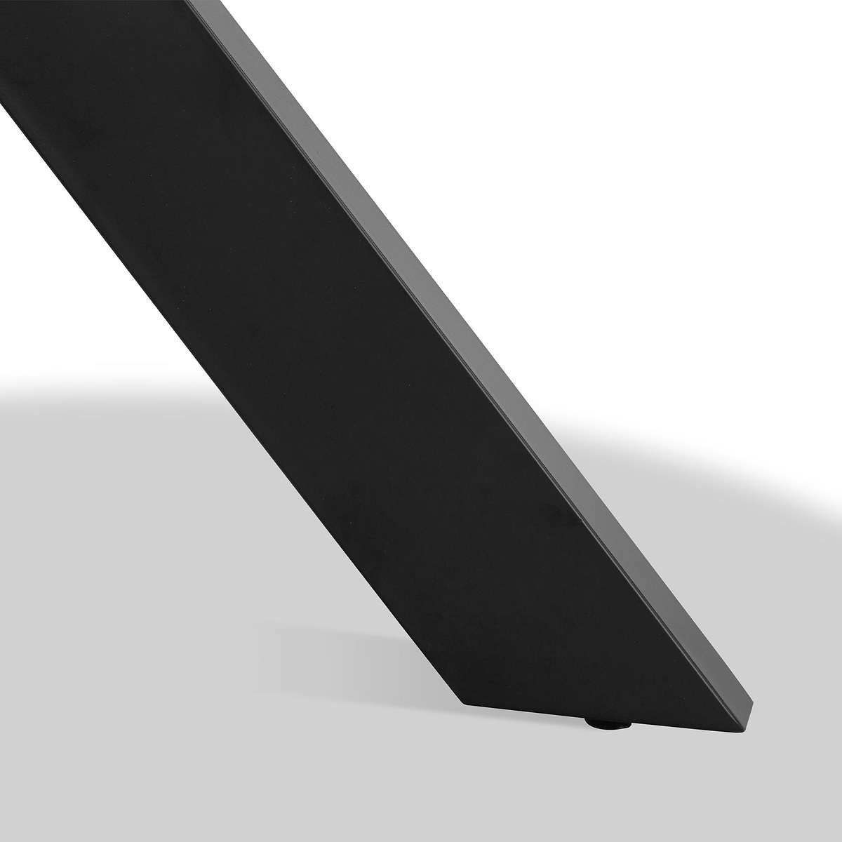 Slim black electronic device angled backwards against a uniform light background, possibly a tablet or monitor in a tilted position.