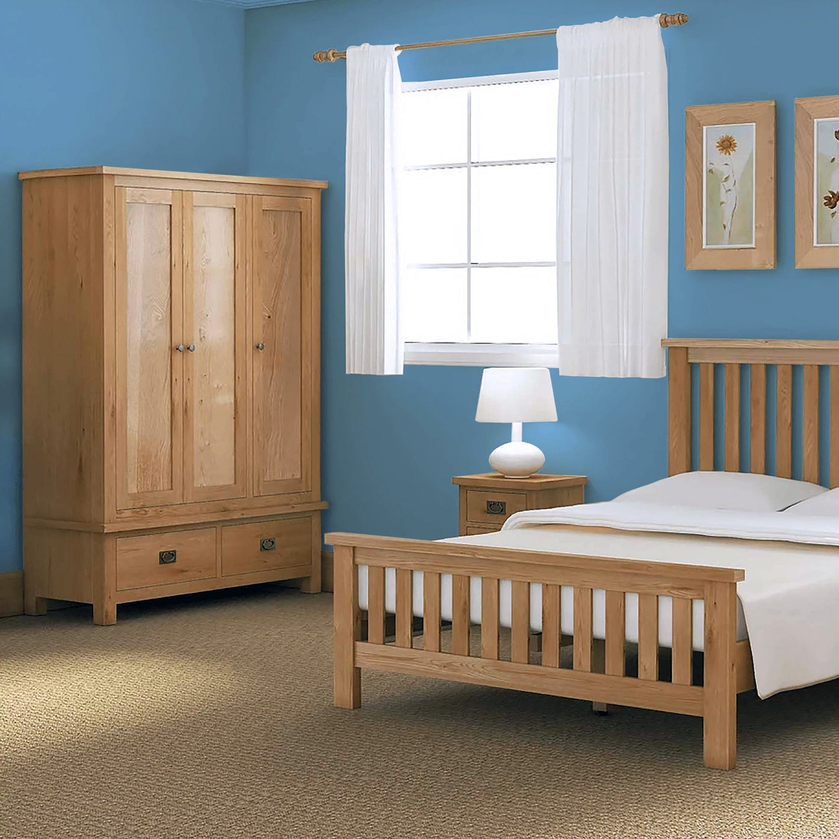 A wooden bed and wardrobe furnish a bedroom with blue walls, white curtains on a window, and a lamp on a bedside table.