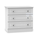 A white chest of drawers with three drawers, each featuring a clear, round knob. It stands isolated against a white background.