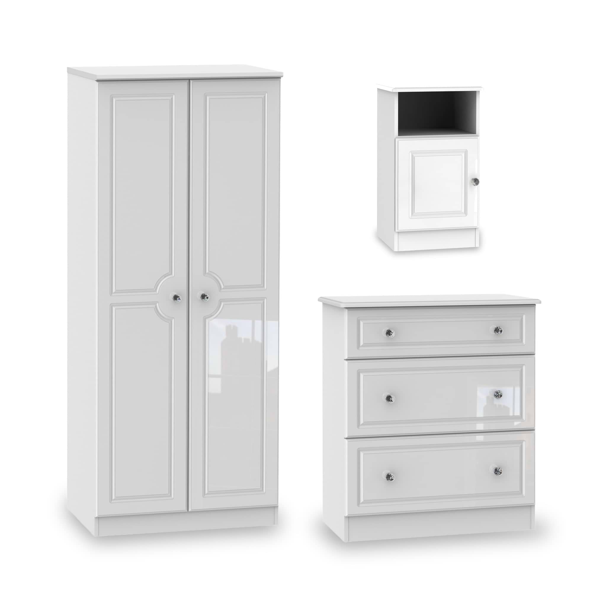 A white wardrobe, bedside cabinet, and chest of drawers on a seamless background, representing modern, simplistic furniture design isolated for display purposes.
