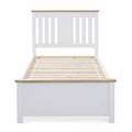 A white wooden bed frame with slatted base, no mattress, stands isolated against a white background.