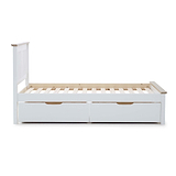 A white daybed with a backrest, side rail, and two under-bed storage drawers sits against an isolated background.
