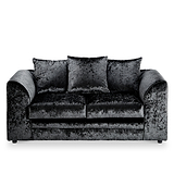 A black velvet sofa with three cushions is centered, isolated against a white background.