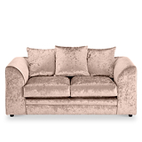 Velvet beige couch with plush cushions against a white background.