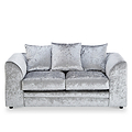 A silver crushed velvet sofa, with two matching cushions, sits idle against a white background, showcasing its plush texture and contemporary design.