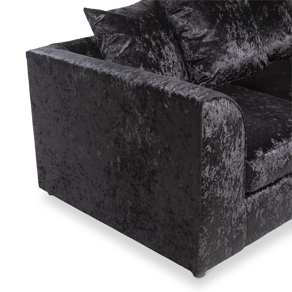 A black crushed velvet sofa with plush cushions, angled view on a white background.