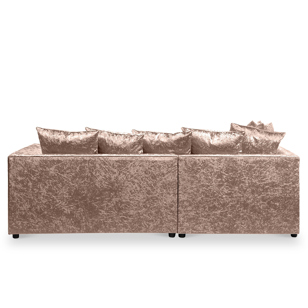 A plush, crushed velvet sofa with multiple cushions against a plain, neutral background.