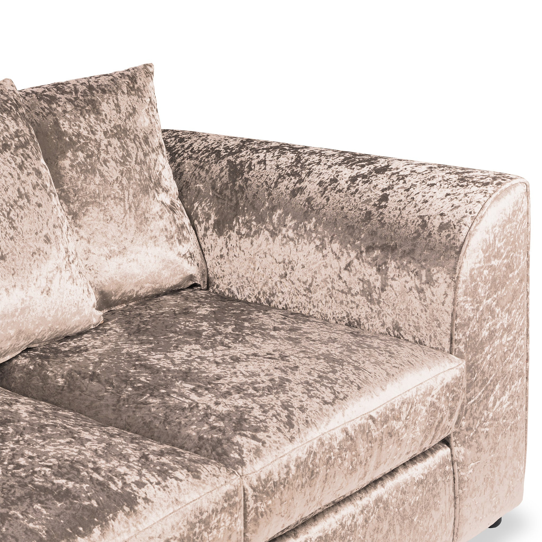 A plush velvet-textured sofa with two cushions, displayed against an isolated backdrop. No discernible action. Context suggests a studio setting for furniture display.