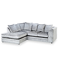 A grey, crushed velvet corner sofa with plush cushions, positioned against a plain white background.