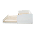 side view of the close up of the white painted wooden frame on the Snooze White Wooden Bed with opened Trundle 