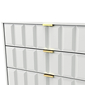 White chest of drawers with a geometric pattern and gold handles against a white background.