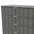 A grey chest of drawers with golden handles stands against an isolated background, its geometric facade creating a contemporary aesthetic.