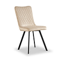 A beige upholstered chair with a quilted backrest and seat, atop four angled black legs, stands isolated on a white background.