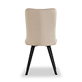 A beige upholstered dining chair with a curved backrest stands on black angular legs against a solid white background.