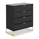 A black four-drawer dresser with gold handles stands against a white background, elevated on a minimalist gold metal frame.