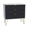 A modern dresser with a geometric black facade and gold handles, standing on splayed gold legs, against a neutral background.