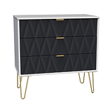 A modern dresser with a geometric black facade and gold handles, standing on splayed gold legs, against a neutral background.