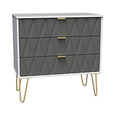 A modern dresser with geometric-patterned gray drawers, gold handles, and slender gold legs stands against a white background.