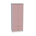 A pink fabric-covered wardrobe with gold handles stands against a white background. It features drawers at the bottom and a curtain-like front.