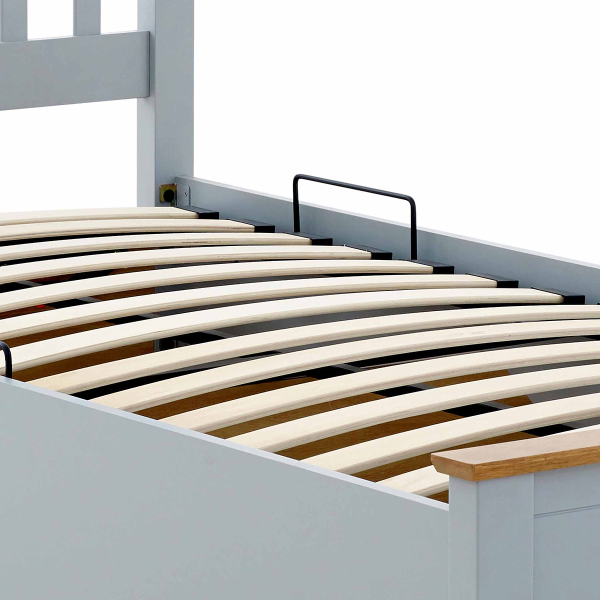 close up of the curved pine slats on the Atlas Grey Single Wooden Ottoman Bed