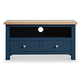 A blue wooden TV stand with a natural wood top rests against a plain background, featuring two drawers and an open shelf with a circular cutout for cables.