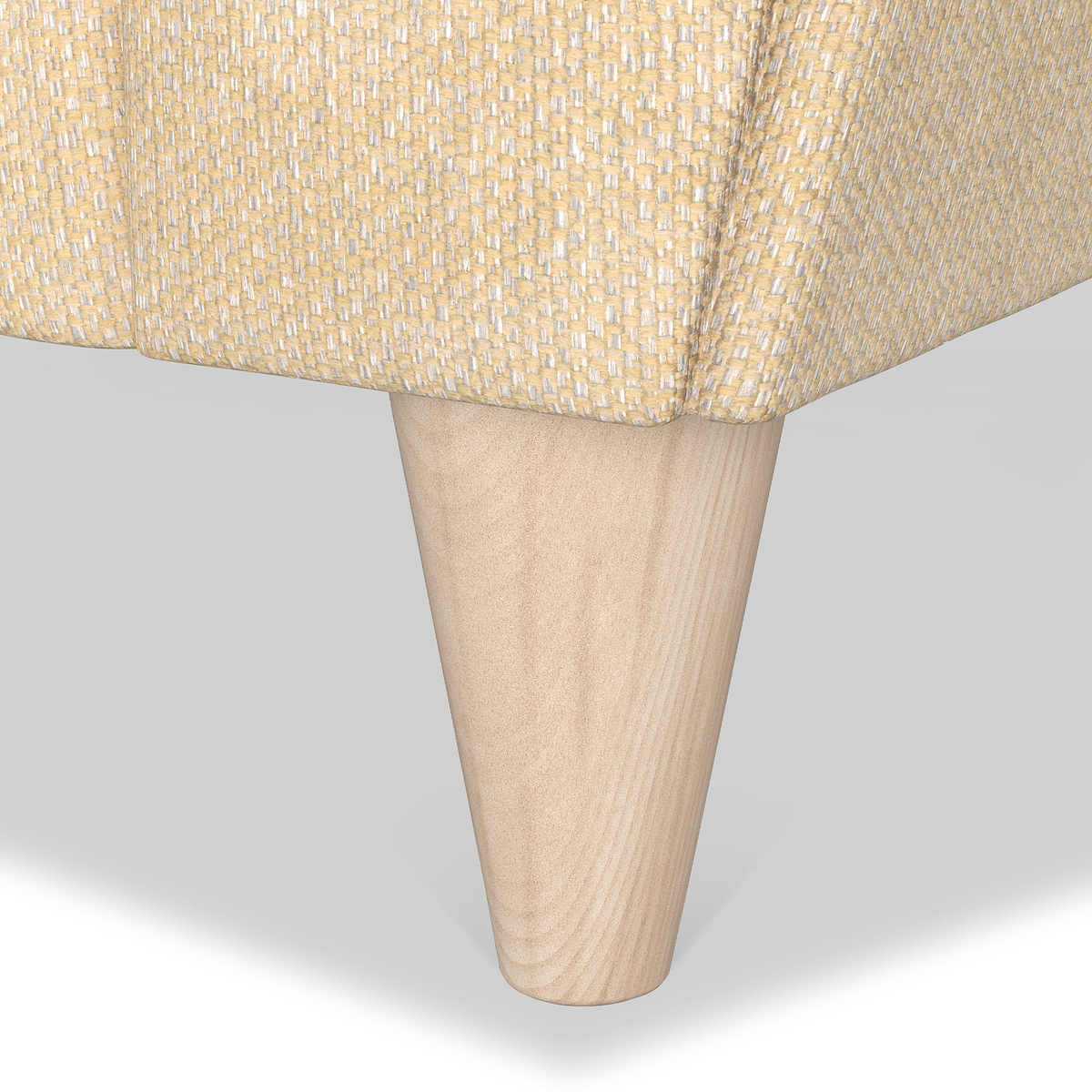 A wooden table leg protrudes diagonally downward from a woven-textured tabletop against a white background.