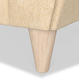 A wooden table leg protrudes diagonally downward from a woven-textured tabletop against a white background.