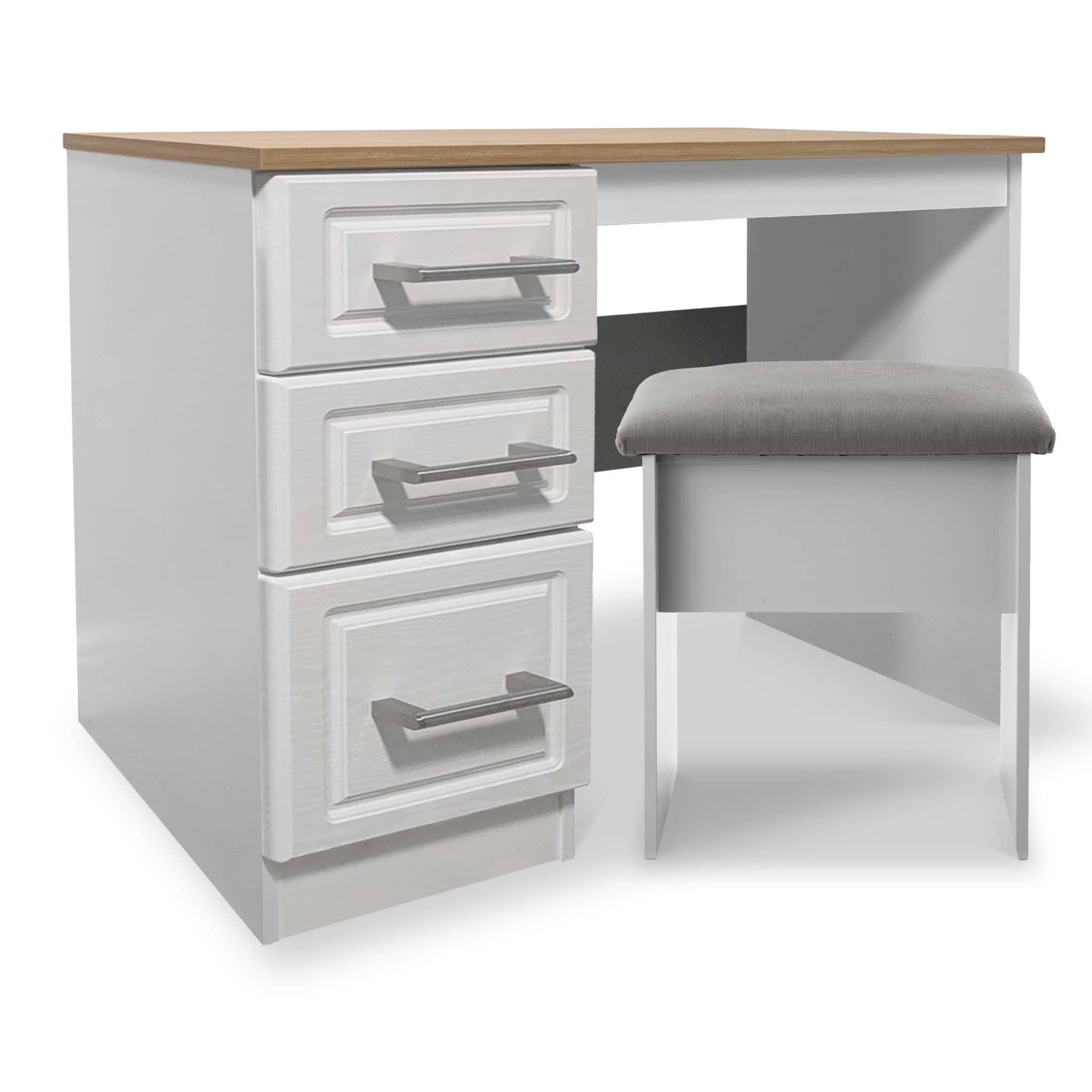 A white desk with a wooden top, three drawers on one side, and a grey cushioned chair, set against a plain background.