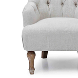 close up of the deep padded seat on the Cream Linen Fabric Bianca Armchair