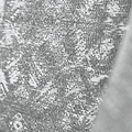 Close-up of a textured fabric with a heathered grey appearance, possibly clothing, with no discernible action or context.