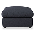 A dark upholstered ottoman with a cushioned top and short black legs, isolated on a white background.