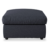 A dark upholstered ottoman with a cushioned top and short black legs, isolated on a white background.