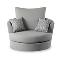 A round gray fabric armchair with one large back cushion and two patterned accent pillows is shown against a white background.