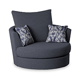 A dark grey, modern armchair with two patterned cushions, positioned against a white background.