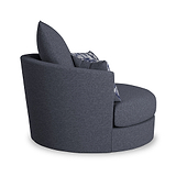 A round, contemporary style dark grey armchair with a high back and one cushion with a blue pattern, isolated on a white background.