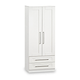 A white wooden wardrobe with two doors above and two drawers below, featuring metal handles, stands isolated against a white background.