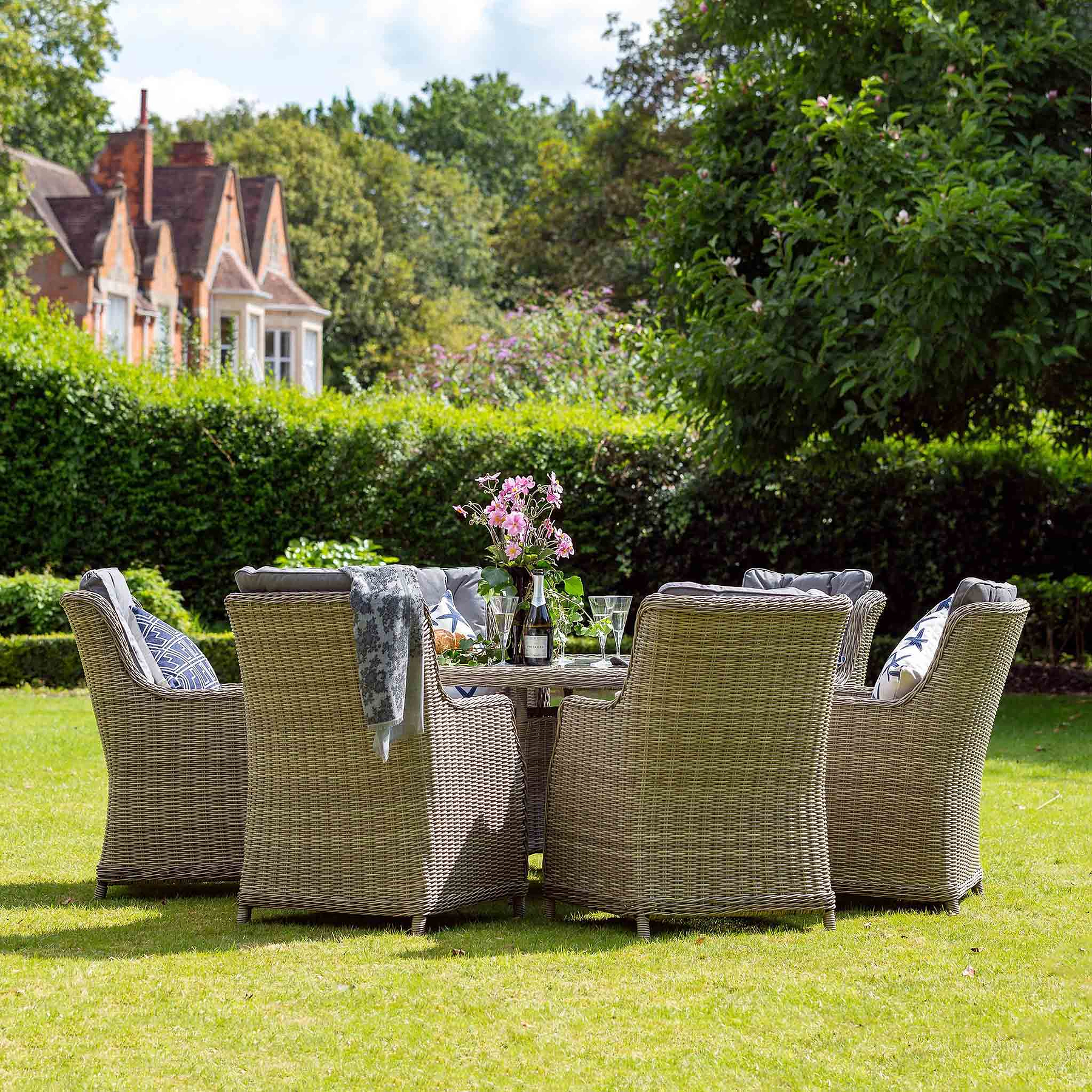 Wentworth 6 Seat 140cm Highback Rattan Garden Dining Set Lifestyle Setting