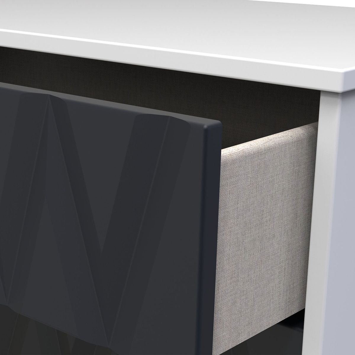 A close-up of a partially open dark drawer under a white tabletop, showing a glimpse of a light-textured object inside.