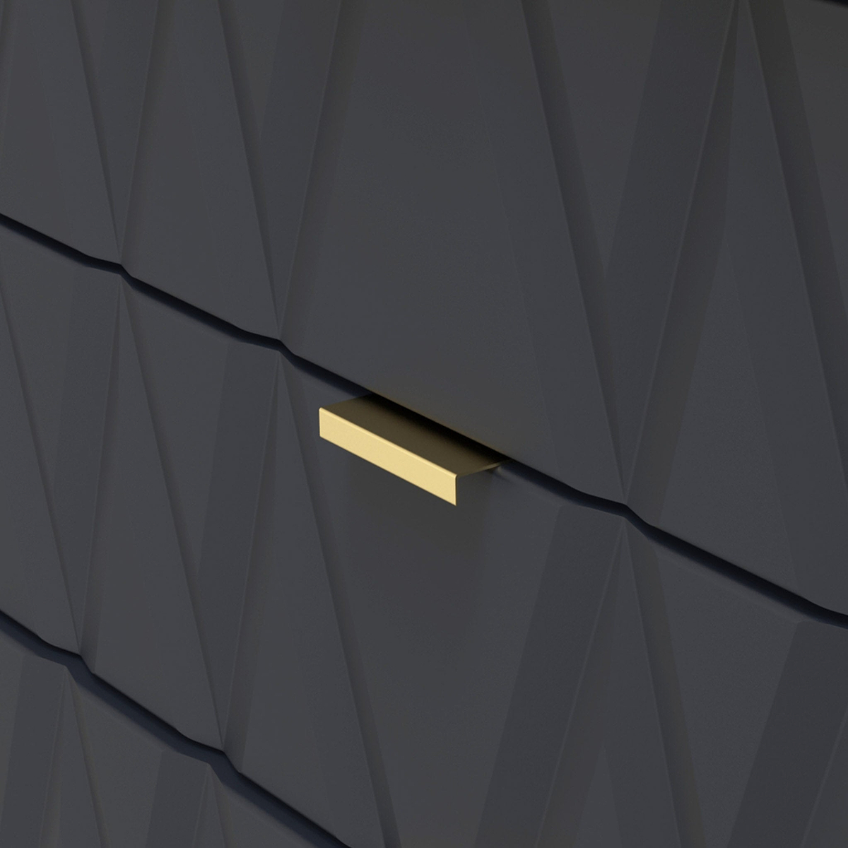 A gold-colored, horizontal mail slot is set into a dark, textured wall with geometric angular patterns.