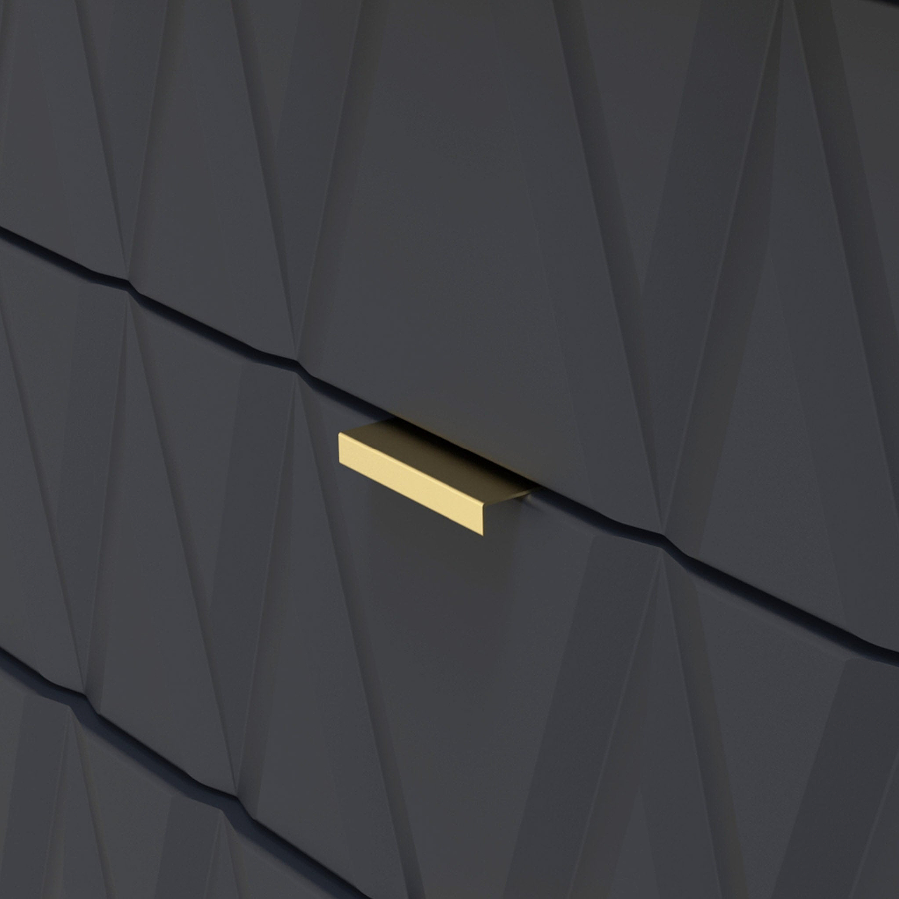 A gold-colored, horizontal mail slot is set into a dark, textured wall with geometric angular patterns.
