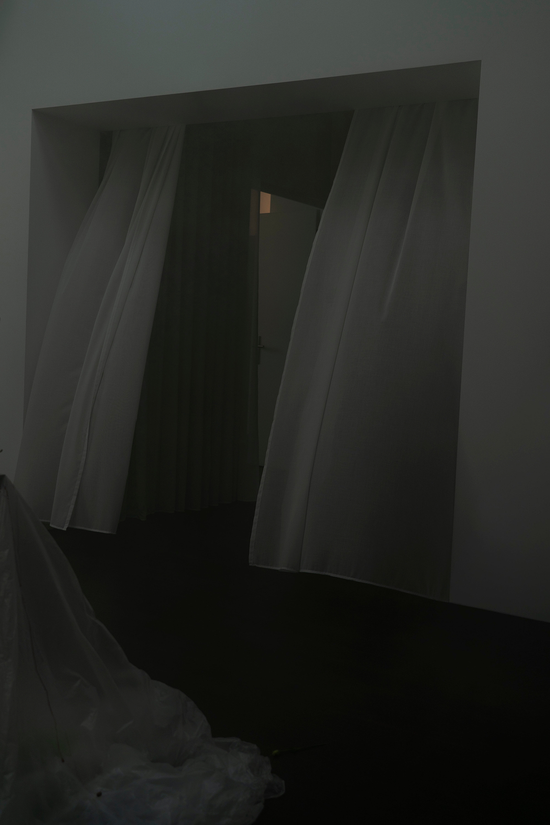 Curtained doorway inside the Berlin apartment hosting the ioannes A Salon presentation.