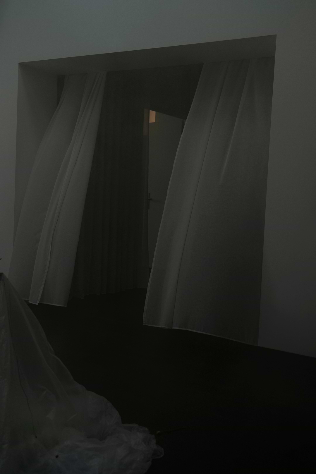 Curtained doorway inside the Berlin apartment hosting the ioannes A Salon presentation.