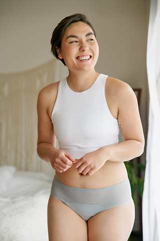 Lily smiling and wearing Saalt period underwear