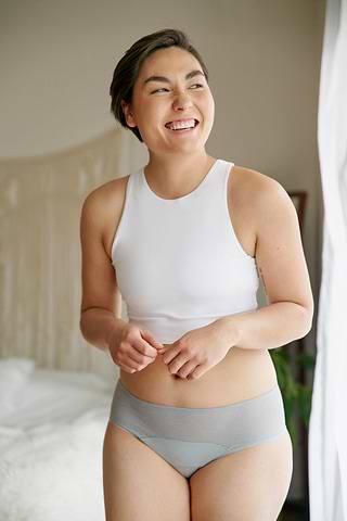 Lily smiling and wearing Saalt period underwear