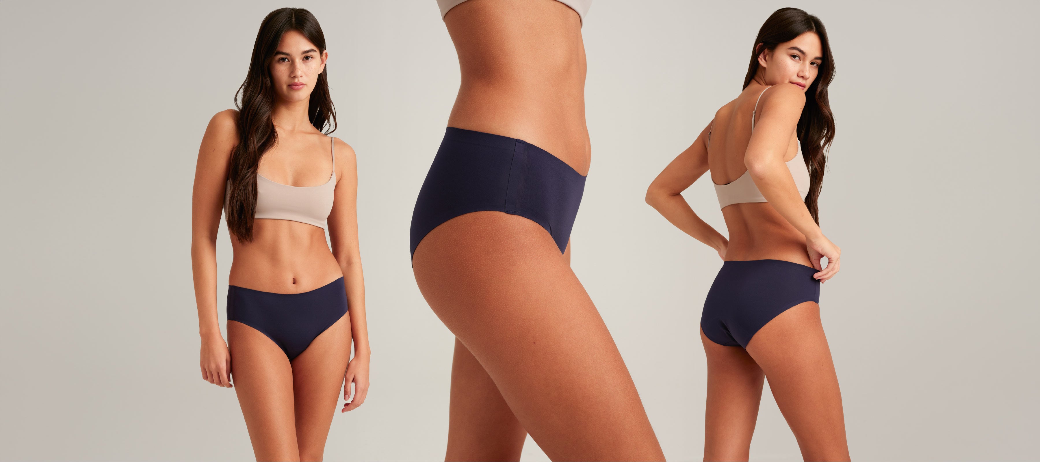 Model showcasing navy seamless high-waisted underwear from multiple angles